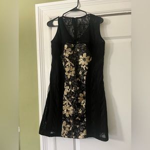 Vestry woman dress black and gold